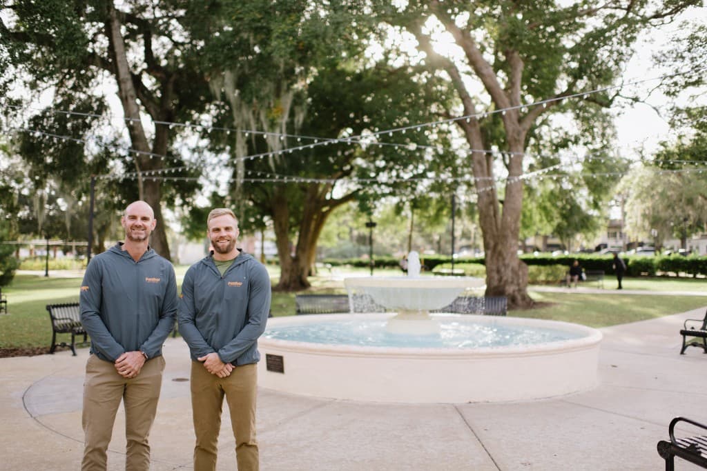 Panther Pest Control owners at Central Park fountain in Winter Park