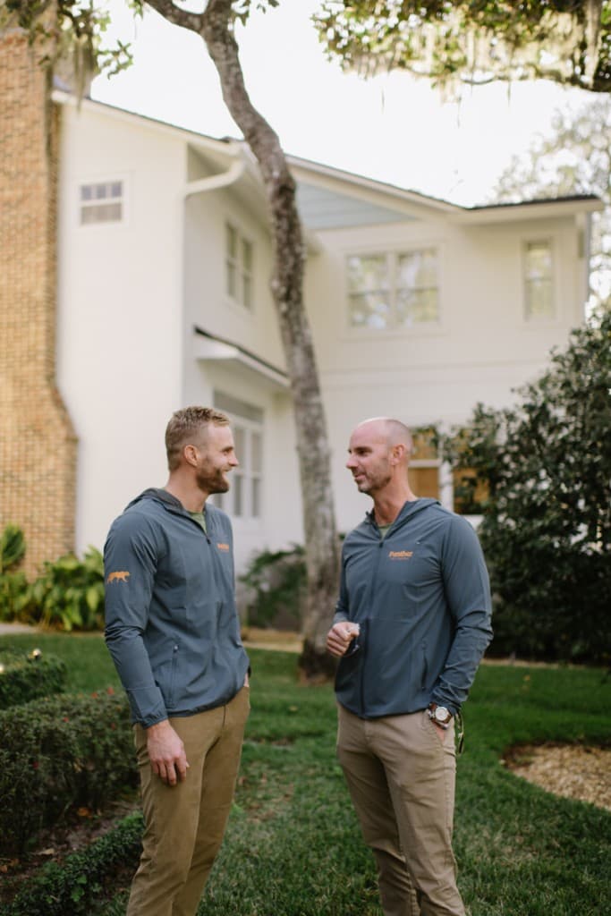 Panther Pest Control founders Darrell Carpenter Jr. and Bo Butler outside an Orlando home