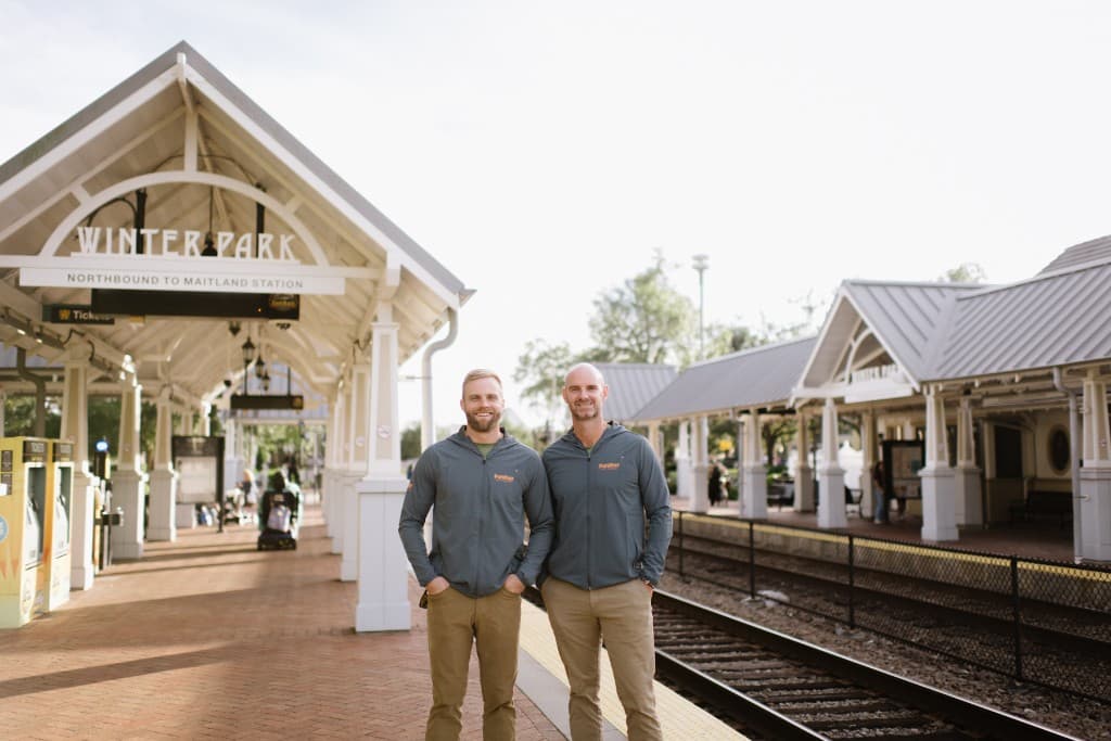 Panther Pest Control founders Darrell Carpenter Jr. and Bo Butler at the Winter Park train station