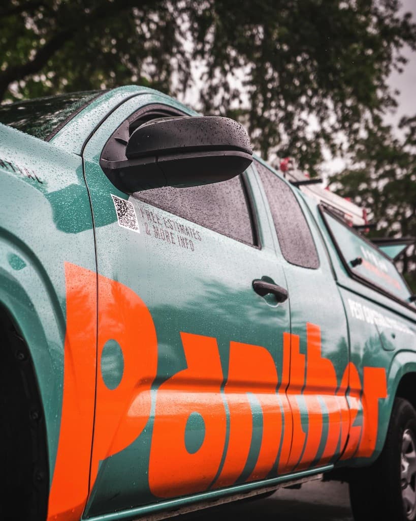 Panther Pest Control wrapped service truck offering a free estimate