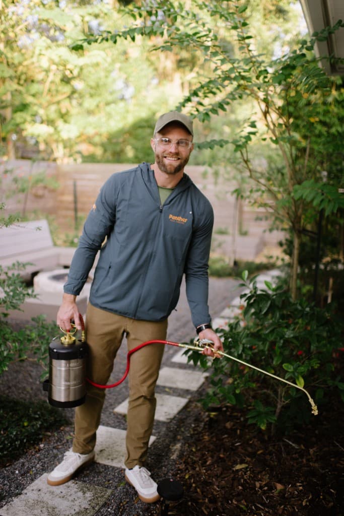 Panther Pest Control technician performing ant treatment at an Orlando home